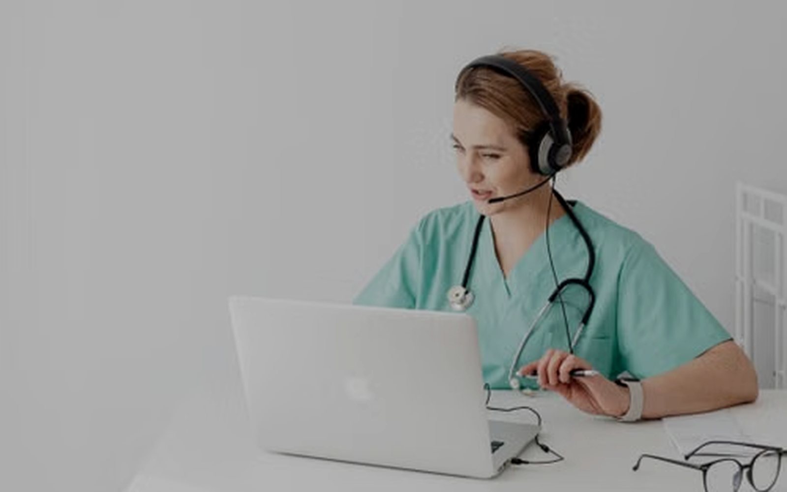 A care manager on a headset talking with a patient